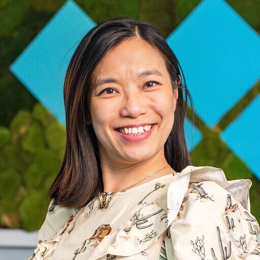 Colleen wears a pair of dark blue heels with a patterned heel