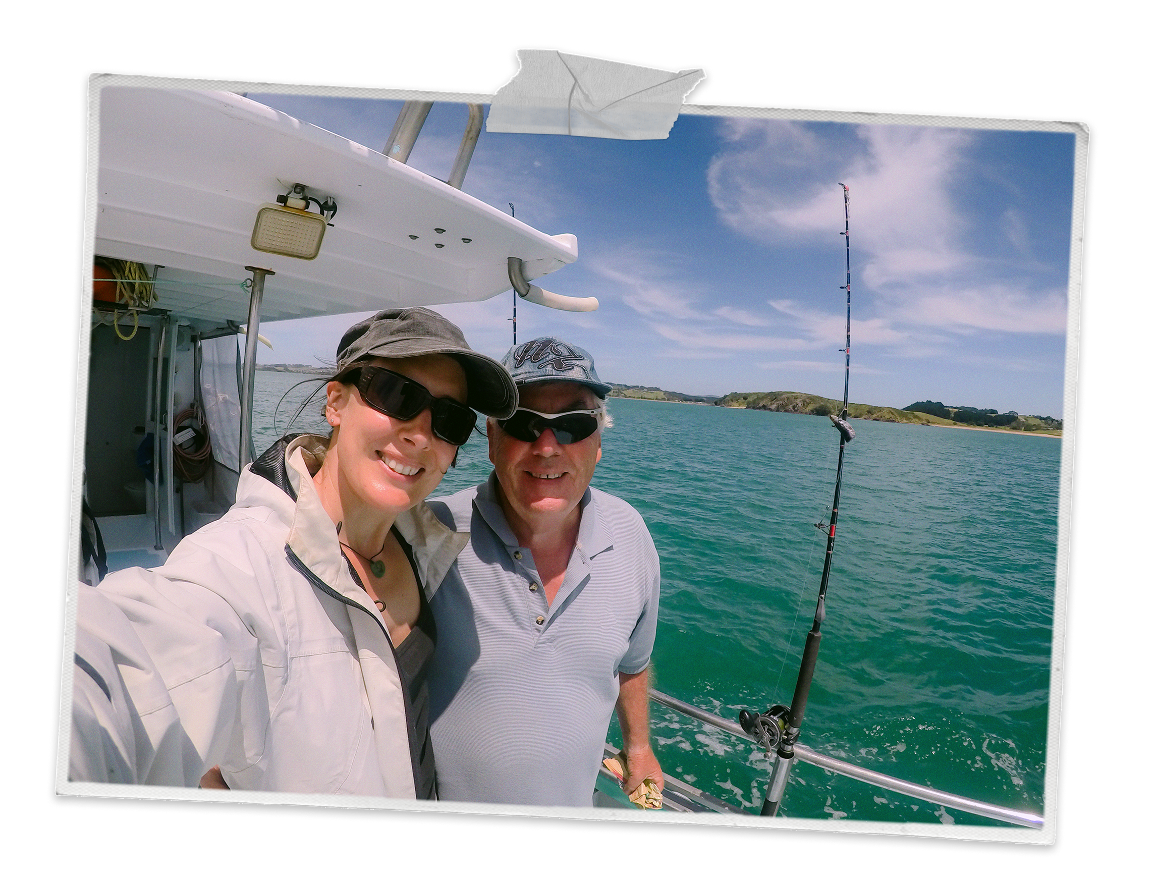 A father and daughter deep sea fishing on a boat