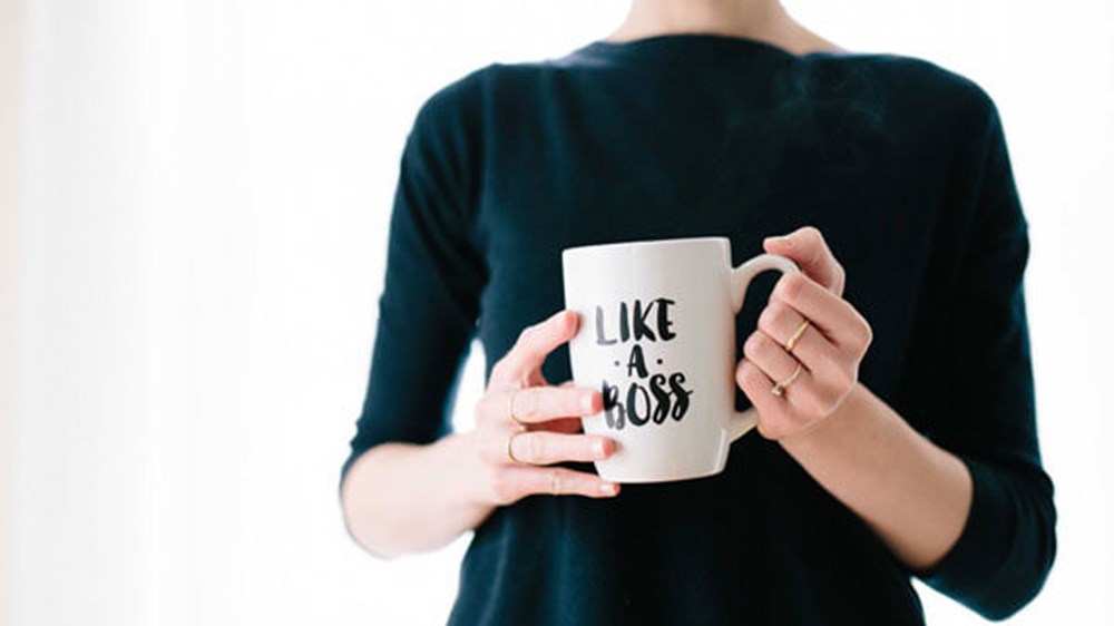 Woman with Like a Boss mug