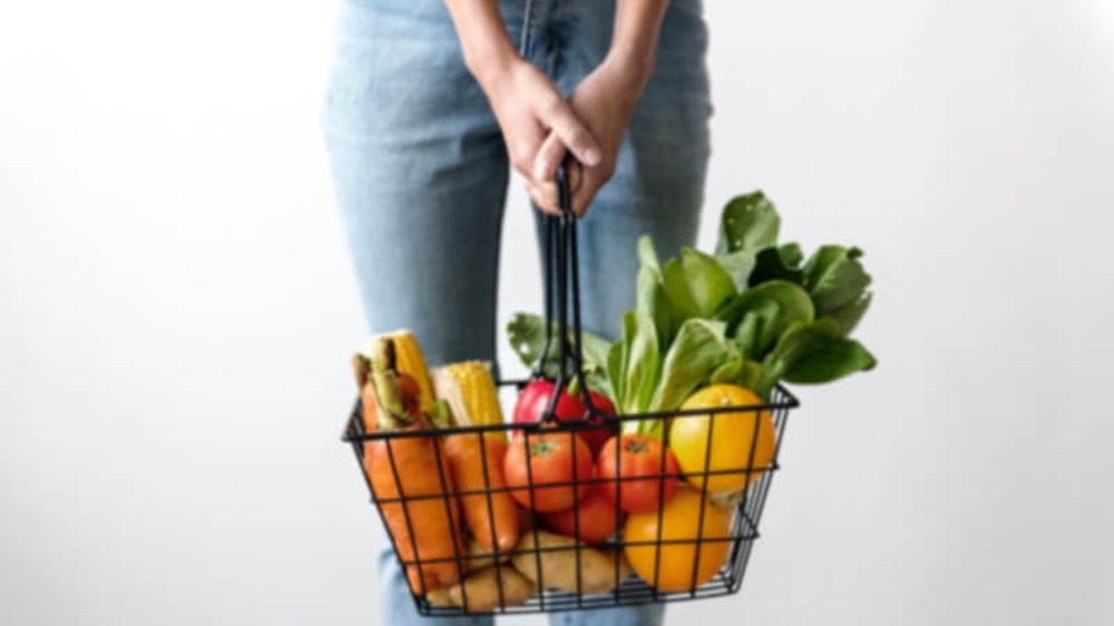 Woman with basket of vegetables