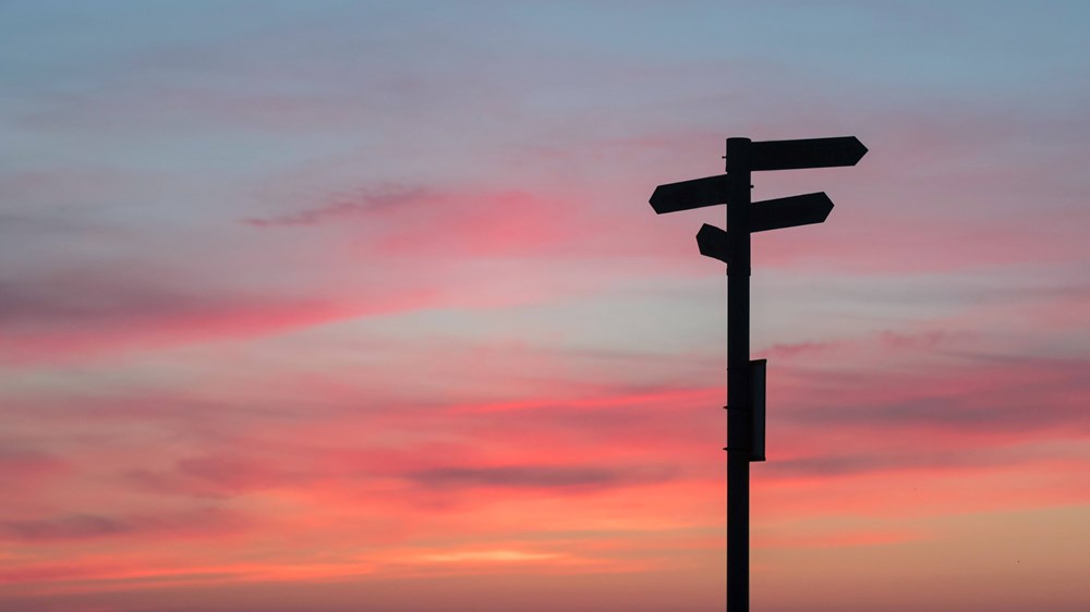 saving for the future image of signpost at sunset