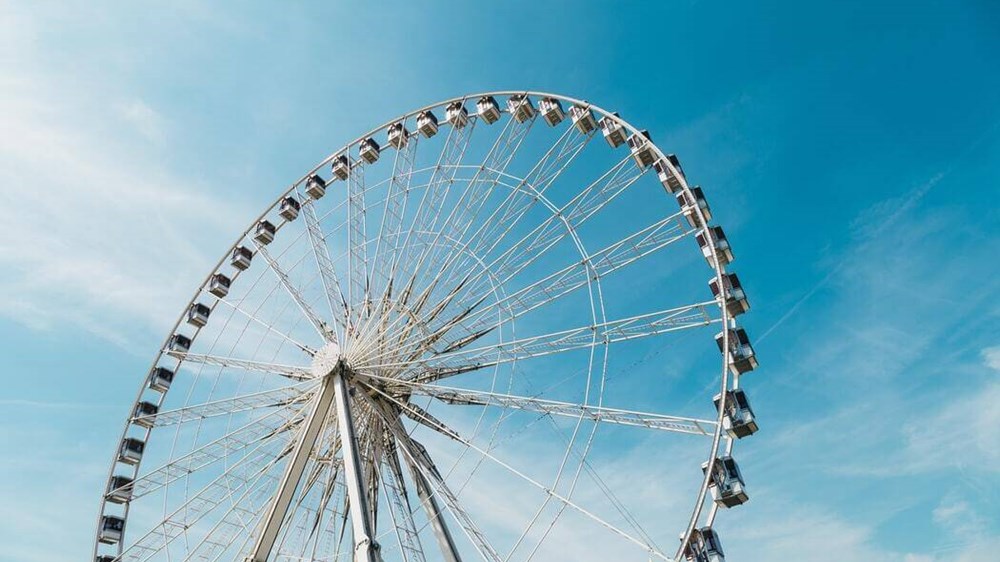 Ferris wheel against blue sky