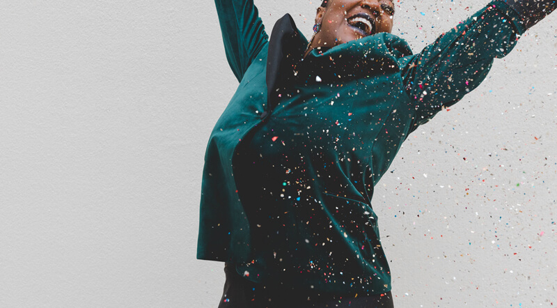 Happy woman jumping in the air | Wealthify