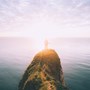 Man looking at the horizon by the sea | Wealthify