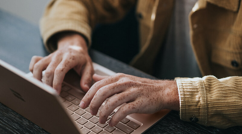 Man typing on his laptop | Wealthify