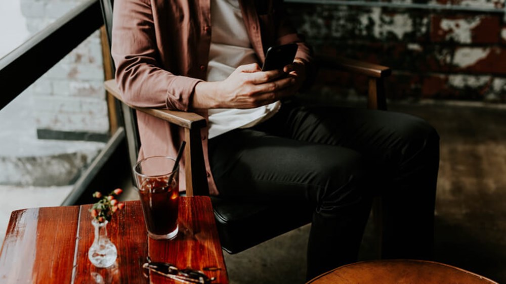 Person checking their phone | Wealthify