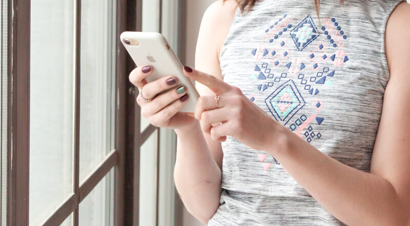 Woman using her phone | Wealthify