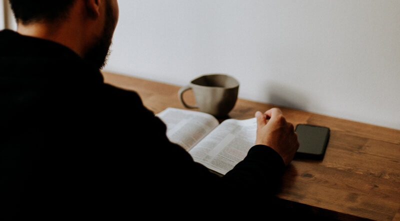 Man reading book | Wealthify