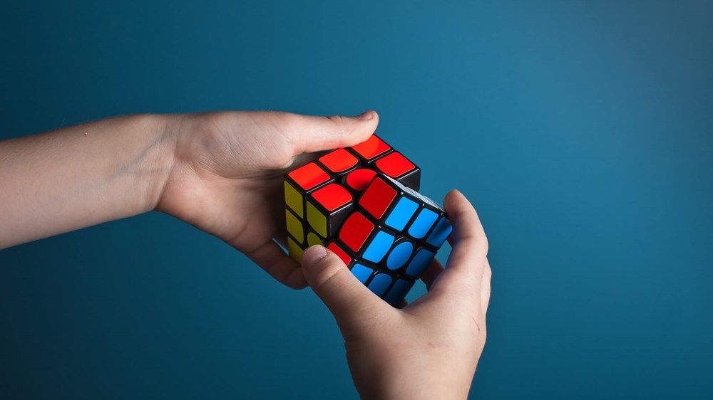 rubix cube on blue background | wealthify.com
