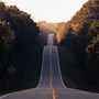 a road that goes up and down among woodlands | wealthify.com