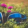 Close up of blue headphones laying on grass