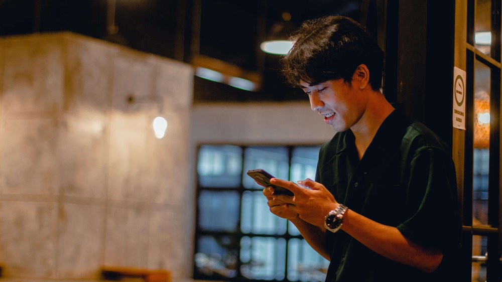 Person Checking Mobile Phone