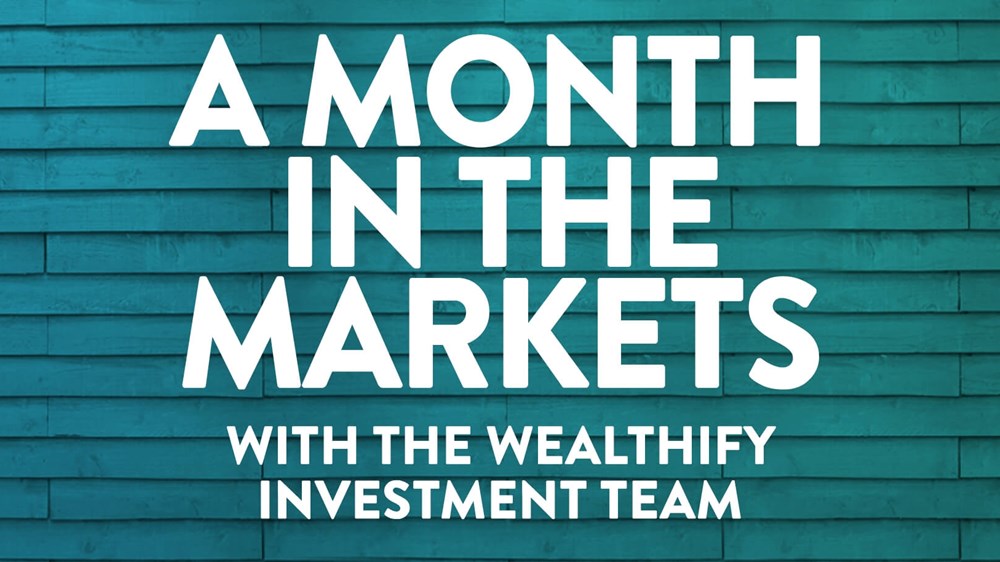 The text 'A month in the markets' written on a blue-green background