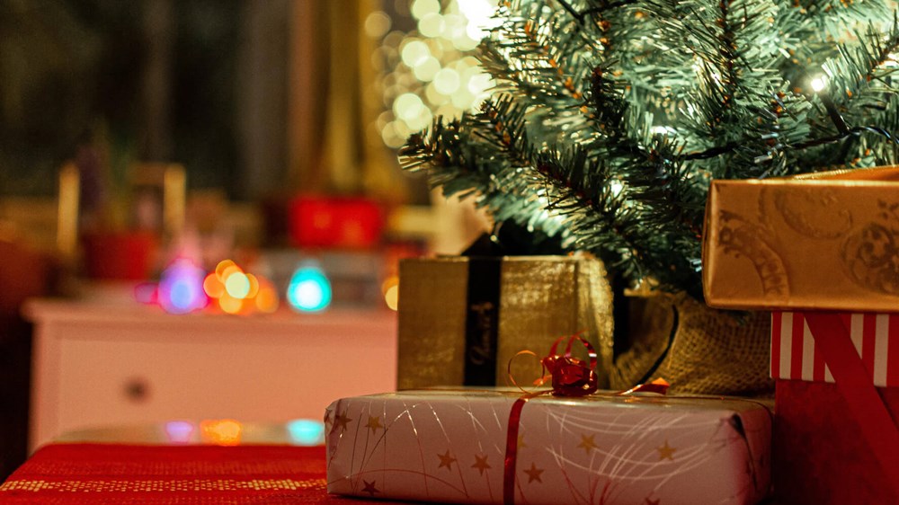 Christmas presents sitting under a Christmas tree | wealthify.com