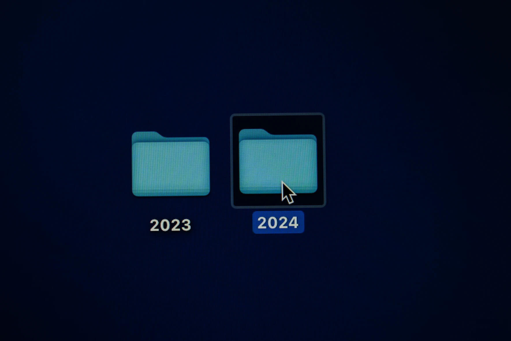 Image of two folders on a computer screen saying 2023 and 2024 on them