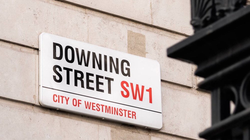 Photograph of the street sign for Downing Street in London.