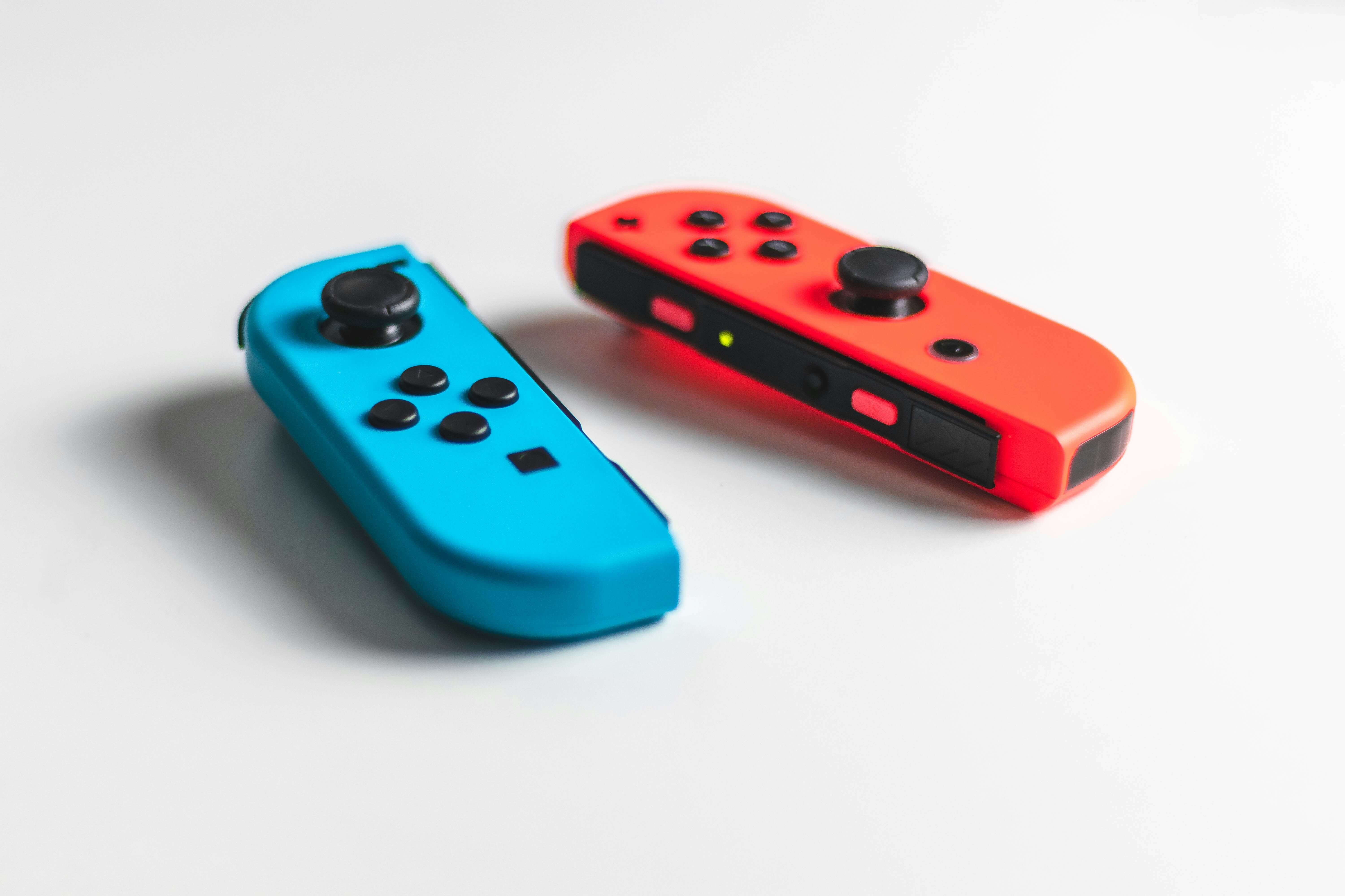 Photograph of a blue and red remote controller for a video game