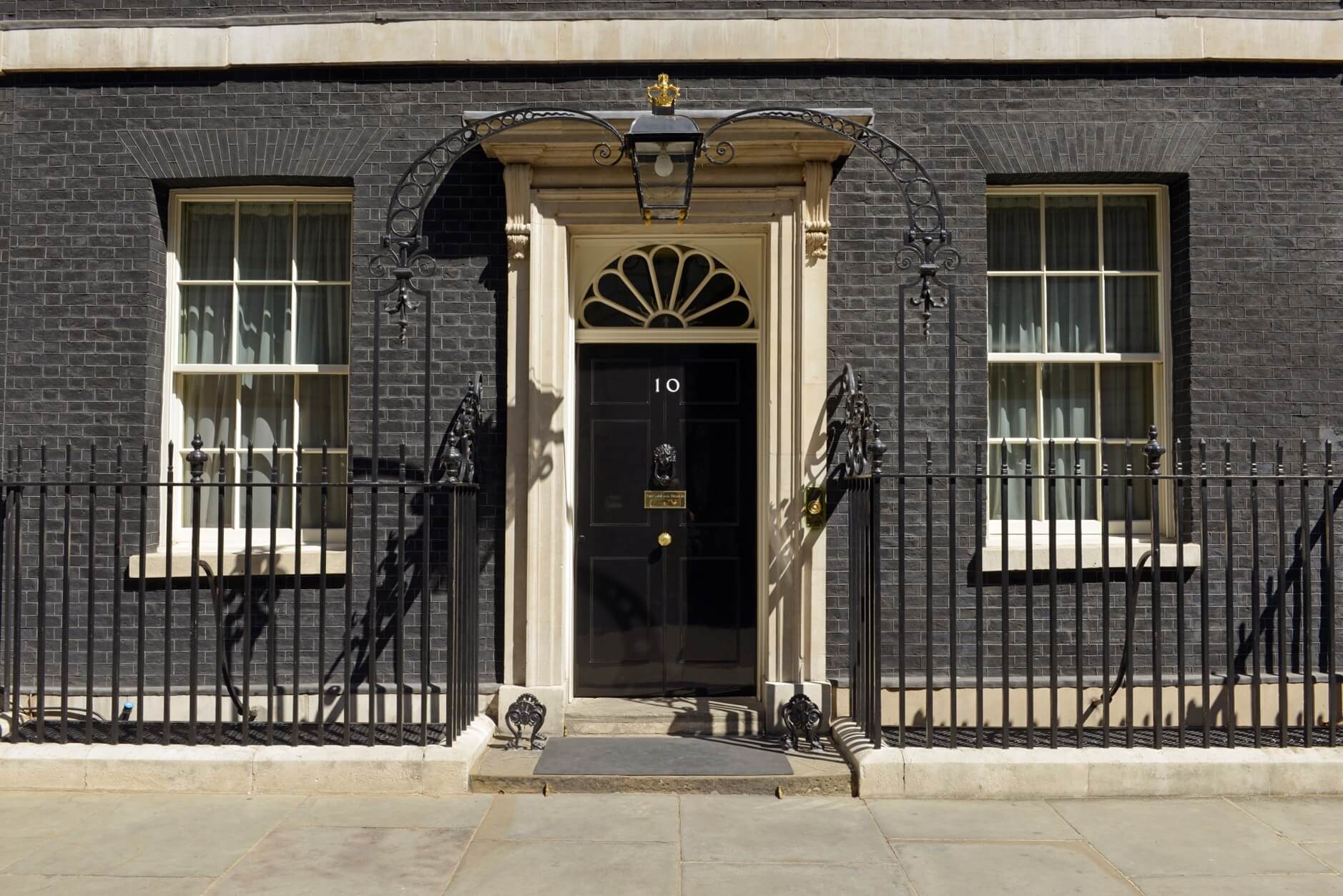 The iconic black door of 10 Downing Street in Westminster, London.