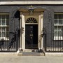 The iconic black door of 10 Downing Street in Westminster, London.